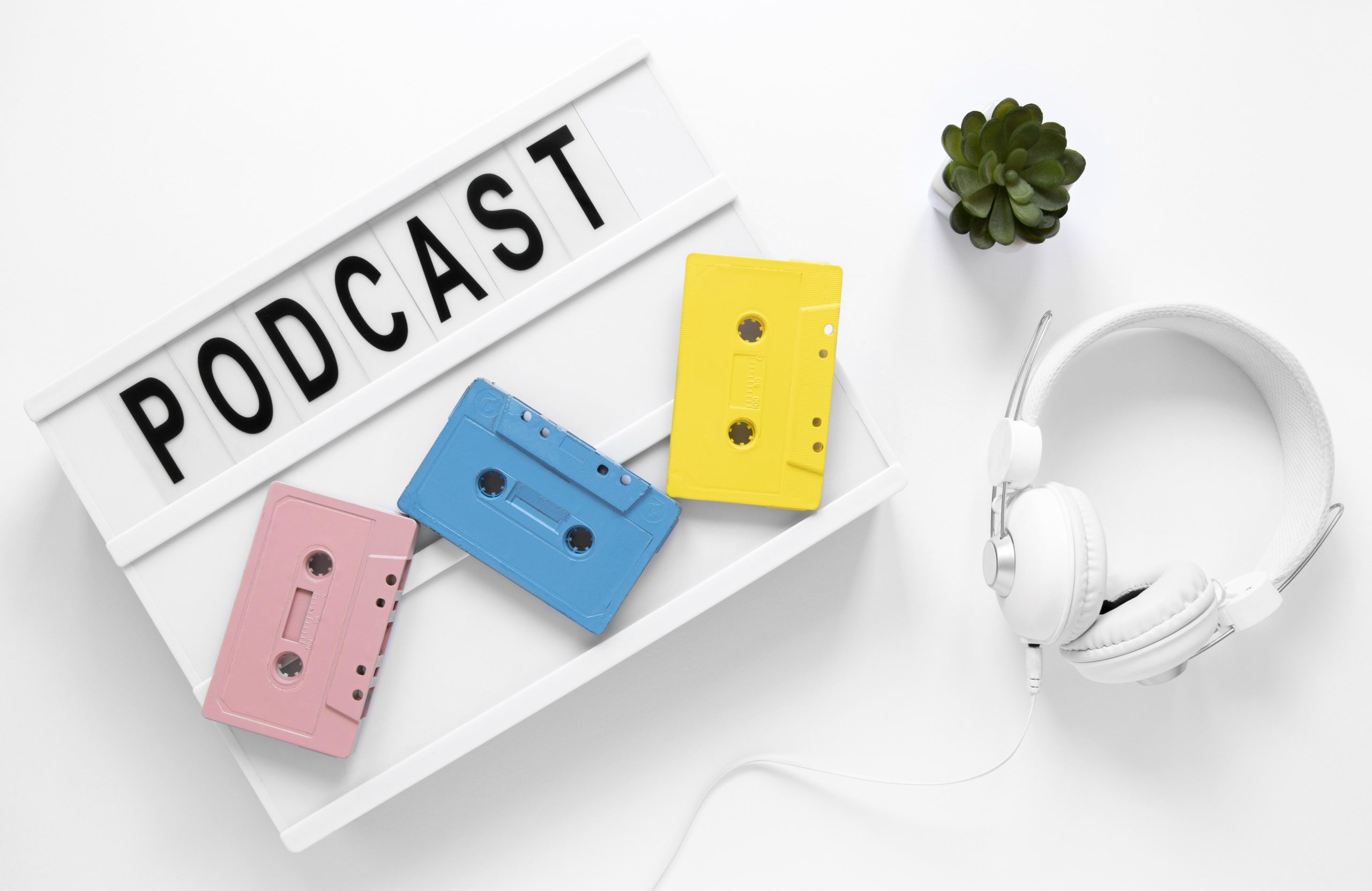 podcast concept, headphones and caset 