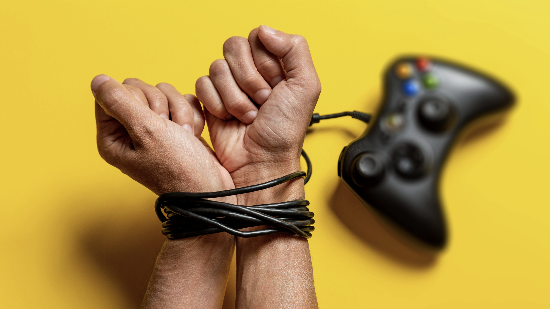 hands tied up with game controller